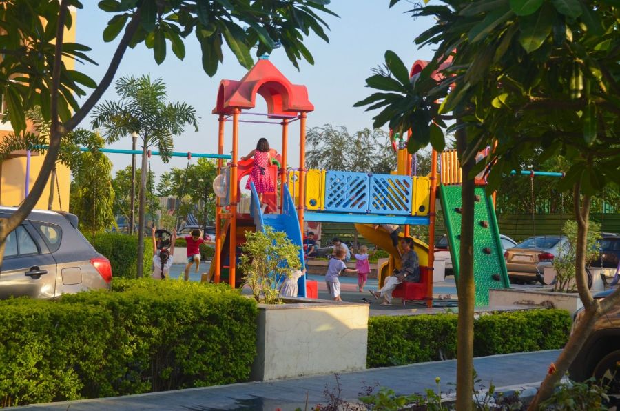 Children on the slides and swings of the kids’ play area at River Valley Township