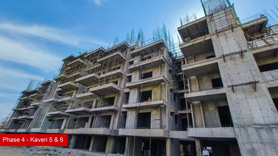 Construction progress at Kaveri Towers 5 and 6, River Valley Township, April 2026: balcony slabs against the sky