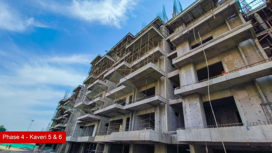 Construction progress at Kaveri Towers 5 and 6, River Valley Township, April 2026: balcony slabs rising floor by floor