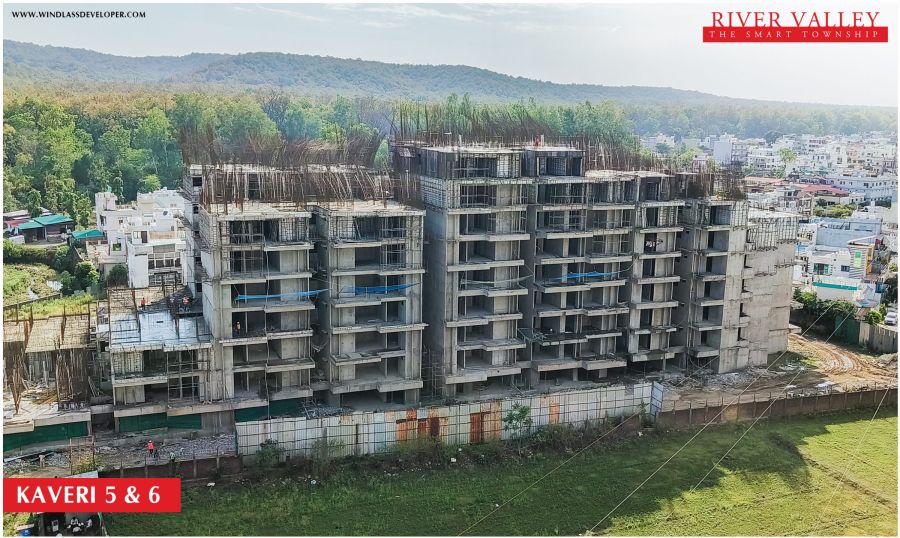 Construction progress at Kaveri Towers 5 and 6, River Valley Township, June 2026: kaveri 5 and 6 across the township green