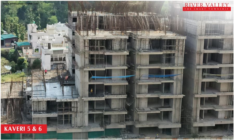 Construction progress at Kaveri Towers 5 and 6, River Valley Township, June 2026: drone view of the upper floors