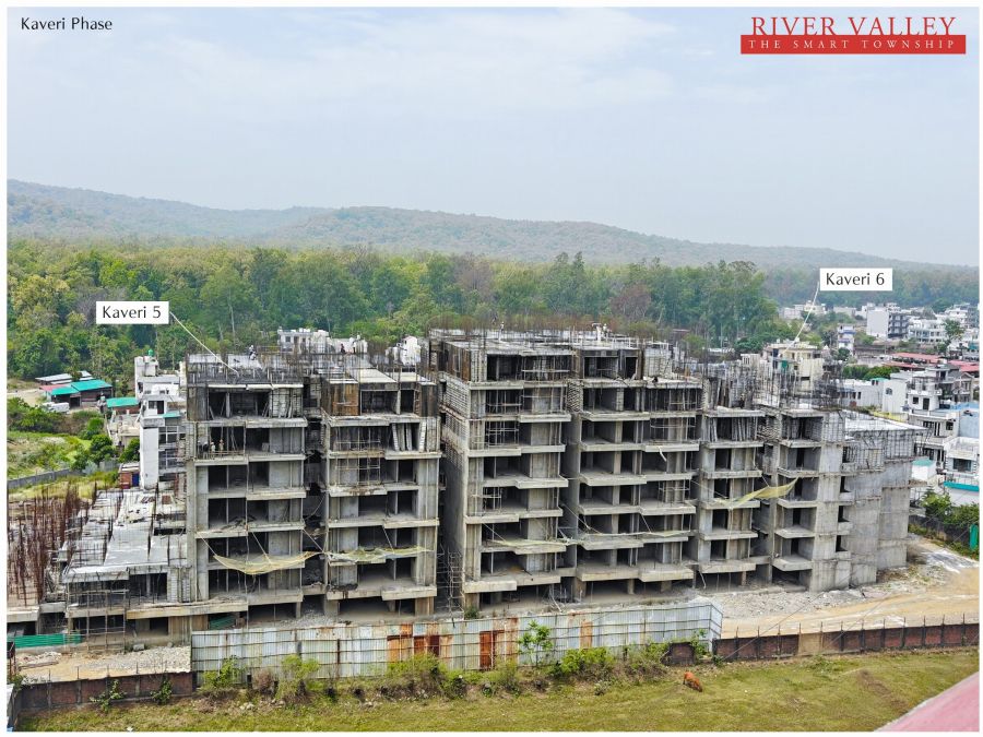 Construction progress at Kaveri Towers 5 and 6, River Valley Township, May 2026: kaveri 5 and 6 with the hills behind